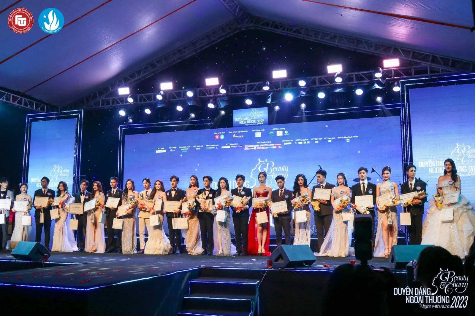 The Alight with Aura finalists lined up across the stage at the close of the night