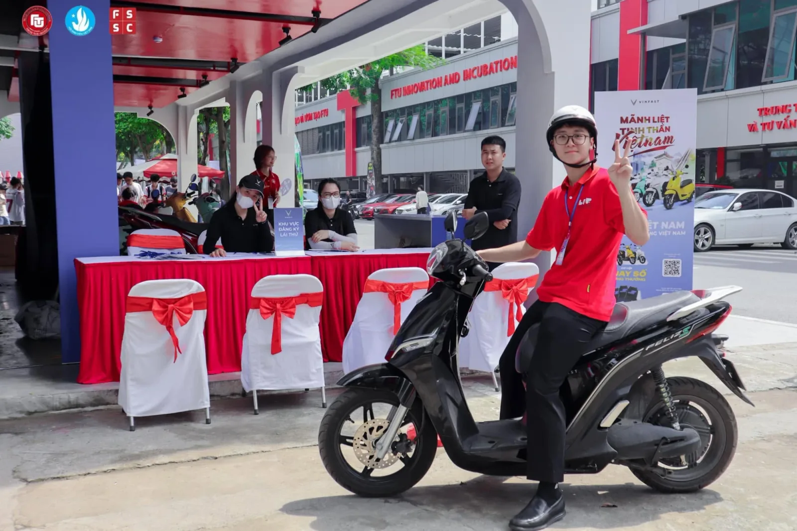 A VinFast test-ride line-up on the FTU forecourt