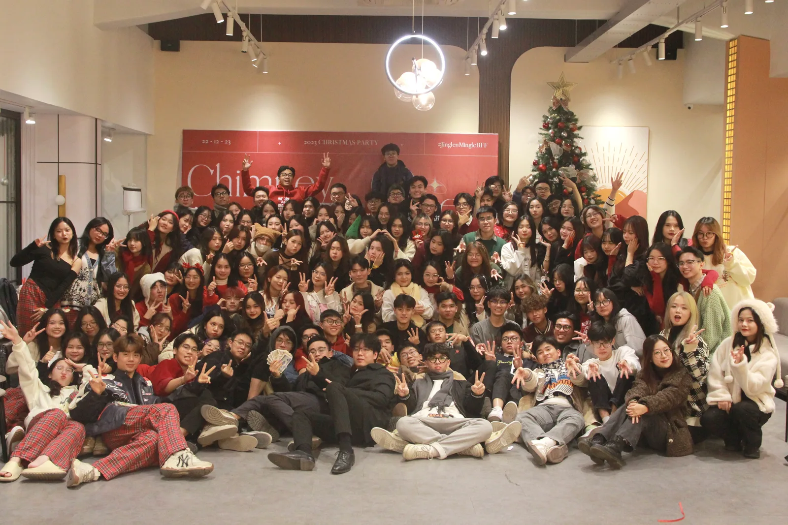 A large group photograph at an evening event
