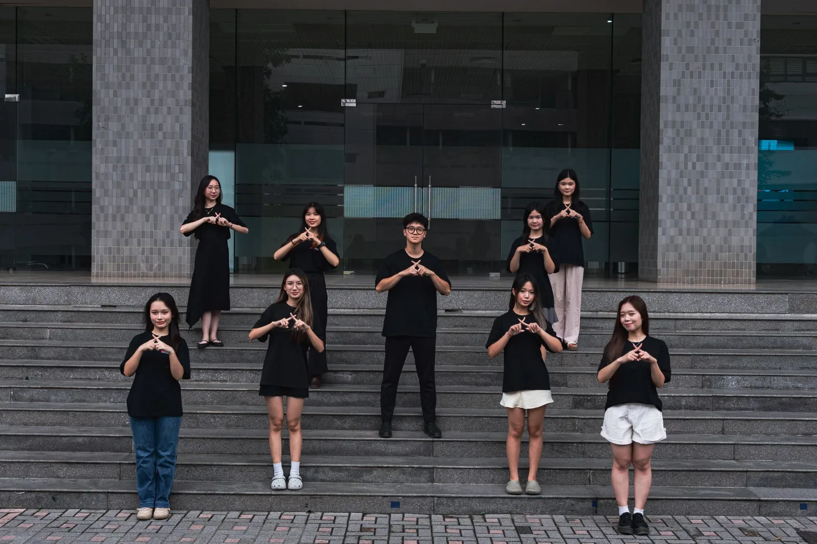 The curation department on the steps of Foreign Trade University, making the TEDx X