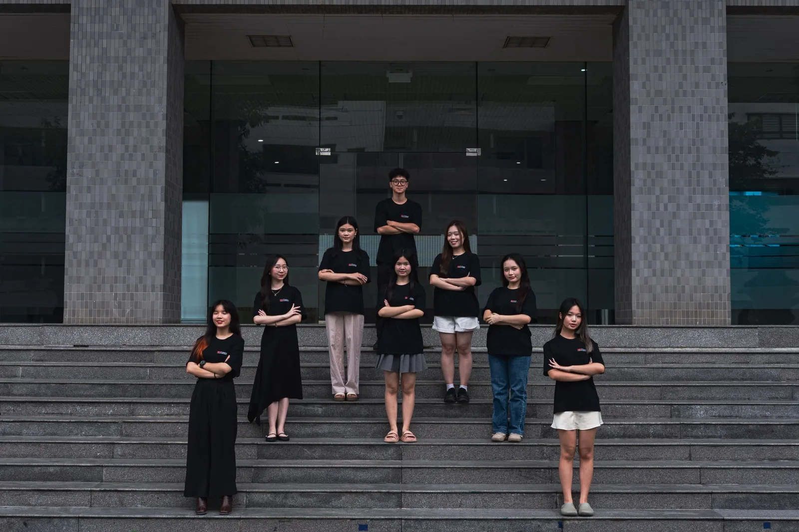 The curation department, arms folded